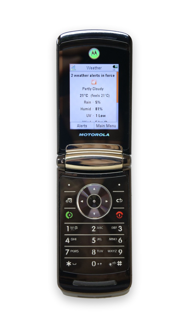 Motorola RAZR2 V8 showing current weather — Partly Cloudy, 21°C, with 2 weather alerts in force